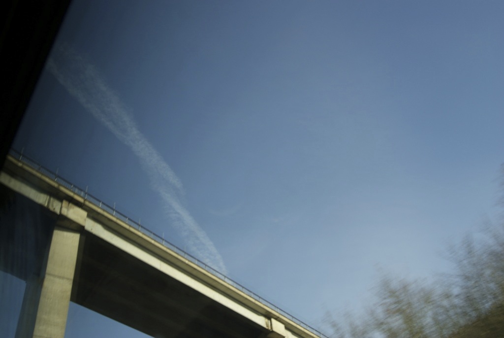 Blue sky with an overhead bridge