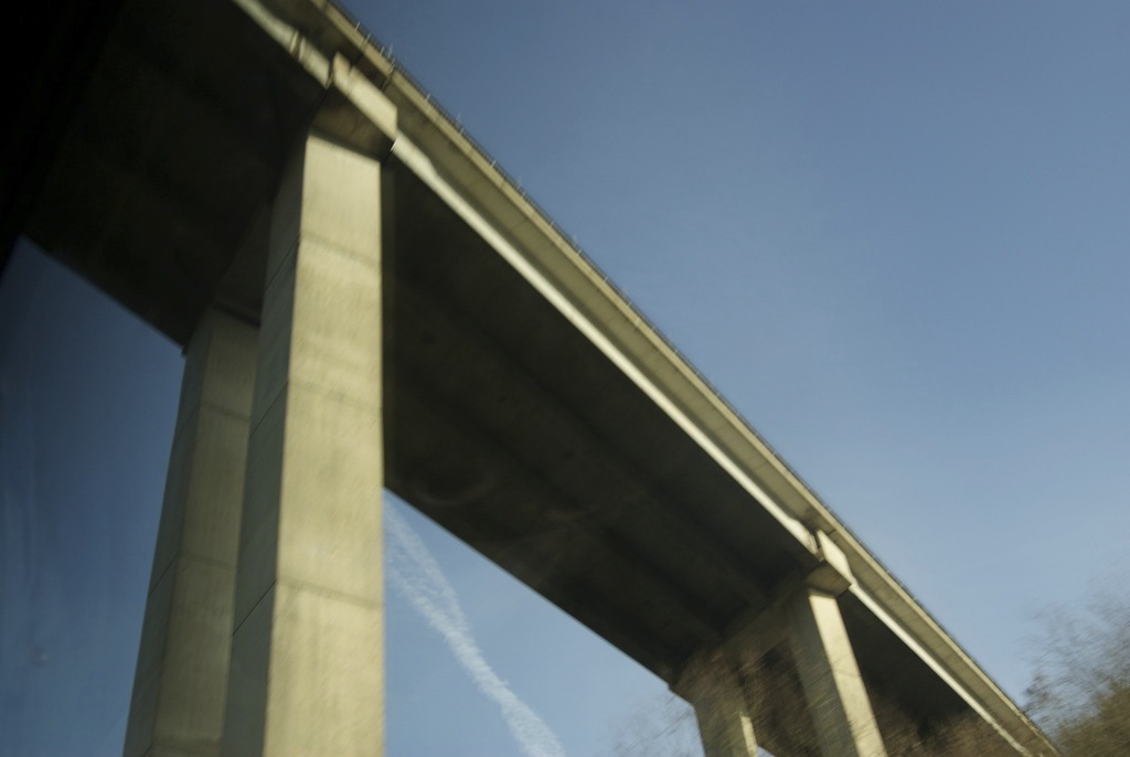 Blue sky with an overhead road bridge